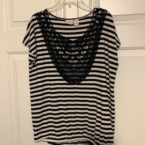 Chicos size 0 black and white sleeveless top with embroidered neck.